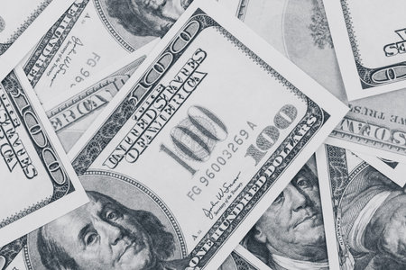 One hundred dollar bills background. Black and white photo
