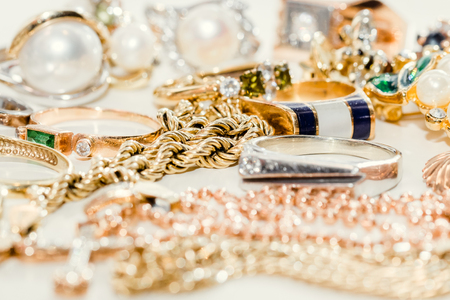 Close up of pile of jewelry on white backgroundの写真素材