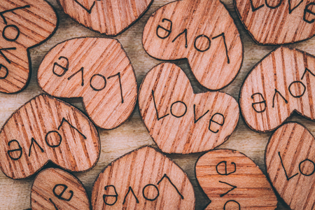 Wooden heart on the tableの写真素材