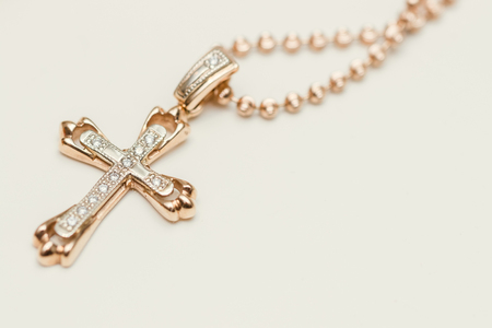 Cross with chain on white backgroundの写真素材