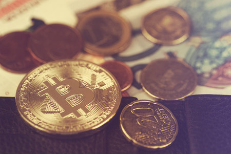 Bitcoin on euro coinsの写真素材