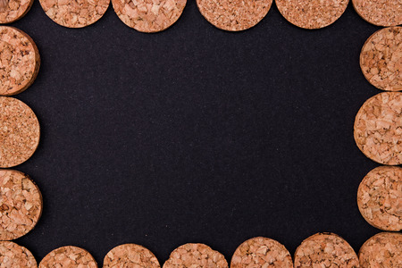 Cork discs on black background.の写真素材