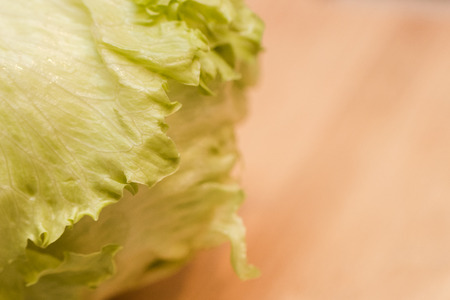 Green cabbage on a wooden tableの写真素材