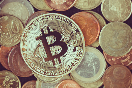 Bitcoin on euro coinsの写真素材