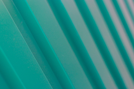 Green metal fence backgroundの写真素材