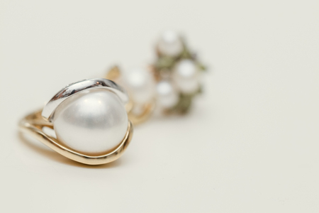 Earrings with Pearl on white backgroundの写真素材