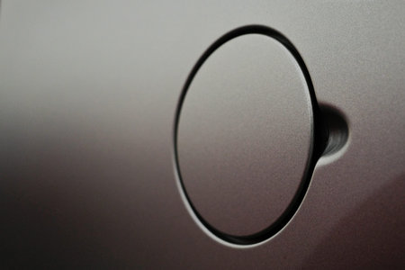 Car oil filler cap close-up.