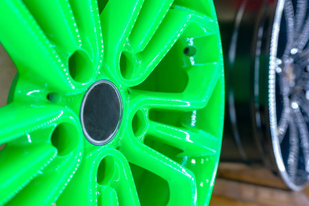 Close up of rims from a sports car.