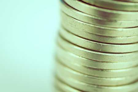 Stack of coins on a white background. Close up. tonedの写真素材