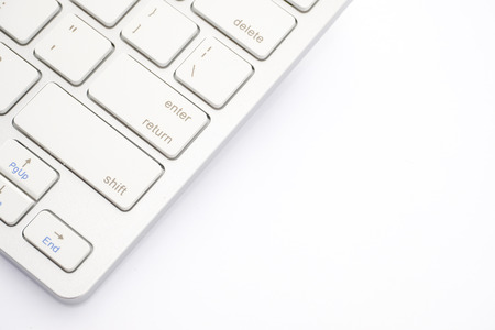White keyboard close up on a white background.の写真素材