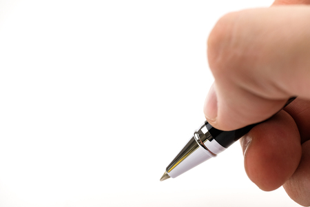 Isolated. Hand hold stylish, ballpoint and metal business pen on a white background.の写真素材