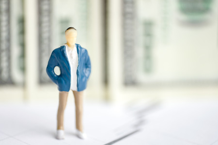 The concept of a successful trader on the exchange. Model man on the background of US dollars.の写真素材