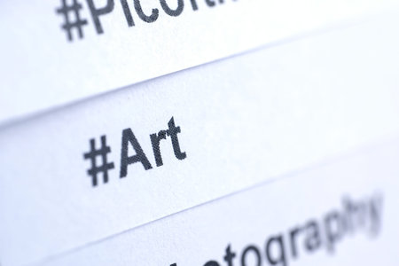 Popular hashtag 'art' printed on white paper. Close up.