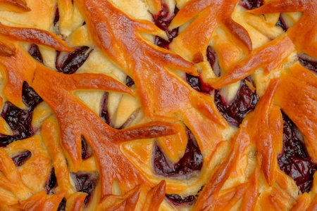 Cherry pie with patterns. Top view. Close up.