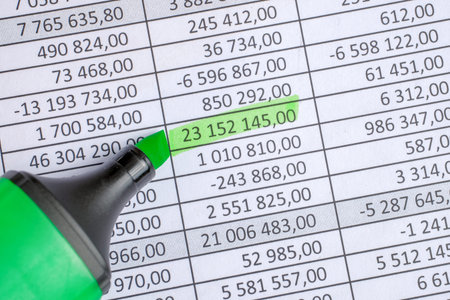 Green marker on paper background with circled totals. Toned. Vertical.の写真素材
