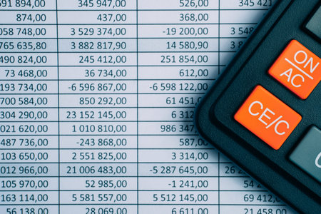 Calculator on paper background with totals right side. Concept financial reports. Toned. Copy space.
