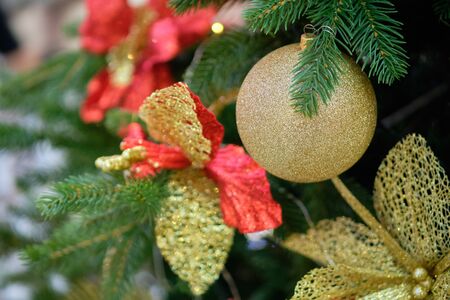 Christmas decorations gold balloon branch. CLose up.の写真素材