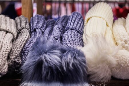 Woolly winter hats on the counter in the store. Copy space. Close up.の写真素材