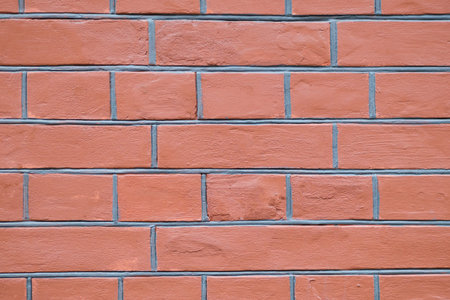 Red brick wall texture background close up