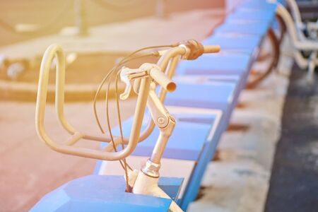 Bike parked for rent. Urban transport improvement concept. close up.の写真素材