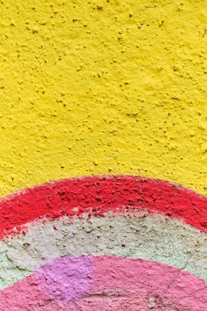 Abstract stucco texture of different color colors - yellow, red, white, pink. Close up.の写真素材