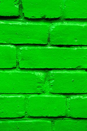Brick wall as a texture painted in green. Vertical.の写真素材