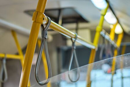 Rubber hinges on metal pipes for safety in public transport. Close up.の写真素材