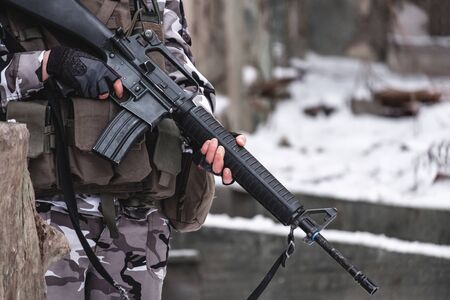 A hired soldier in camouflage near a sleep guard post. Close up.の写真素材