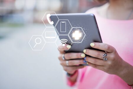 Healthcare and online help concept - woman holds tablet. Close up.の写真素材