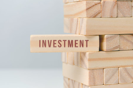 Investment concept - wooden blocks with text on a white background. Close up.の写真素材