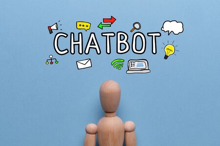 Chatbot concept - abstract doll on a blue background with text and icons. Close up.の写真素材