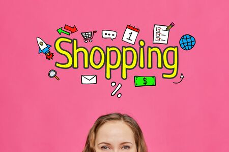 Shopping girl concept with text and icons on a pink background. Close up.の写真素材