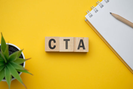 Modern marketing buzzword - CTA Call to action. Top view on wooden table with blocks. Top view....
