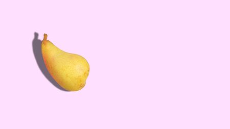Ripe pear on a pink background with copy space. Close up.の写真素材