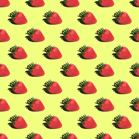 Seamless pattern of strawberries on a yellow background. Close up.の写真素材