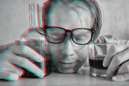 A drunk man in glasses sleeps on a table with a bottle and a glass and the effect of the glitch of a...