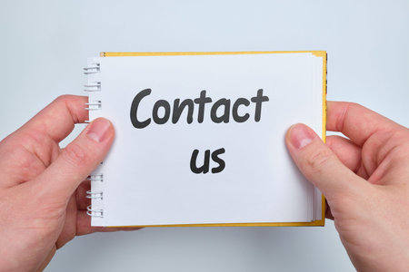 Lettering on paper contact us as a feedback concept. Close up.の写真素材