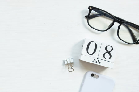 8th july eighth Day of month calendar concept on wooden blocks with copy space