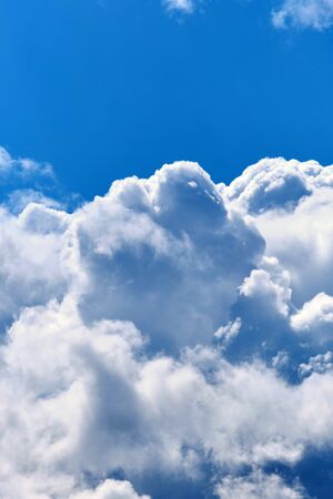 White clouds in the blue sky copy space verticallyの写真素材