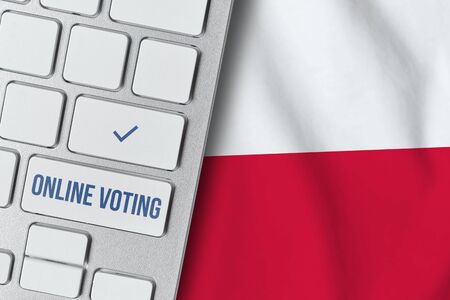 Online voting concept in Republic of Poland. Keyboard near country flag.の写真素材