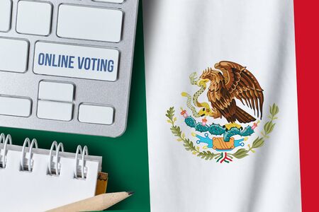Online voting concept in United Mexican States. Keyboard near country Mexico flagの写真素材
