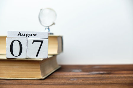 7st august - seventh day month calendar concept on wooden blocks with copy space.