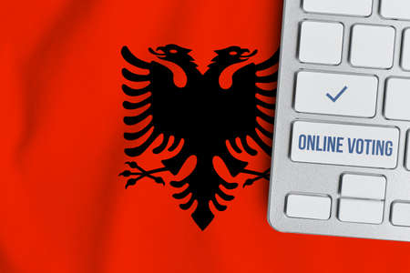 Online voting concept in Republic of Albania. Keyboard near country flagの写真素材