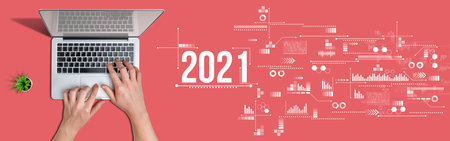 Hands on a laptop with the inscription 2021 next to it. Red background