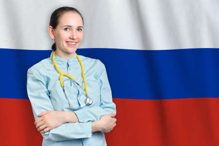 Russian Federation healthcare concept with doctor on flag background. Medical insurance, work or study in the countryの写真素材