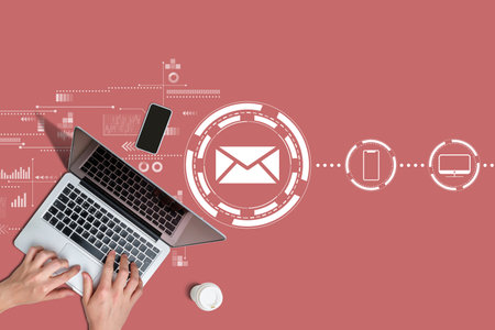 Email communication concept with hands and laptop.