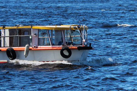 Pleasure boat for passengers floats on the sea.