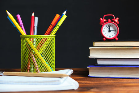 Back to school concept with textbooks with stationery.