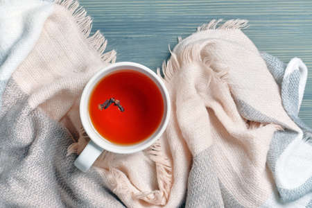 Autumn concept with tea and scarf with top view.の写真素材