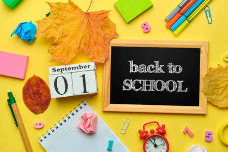 Lettering back to school in a frame with stationery around.の写真素材